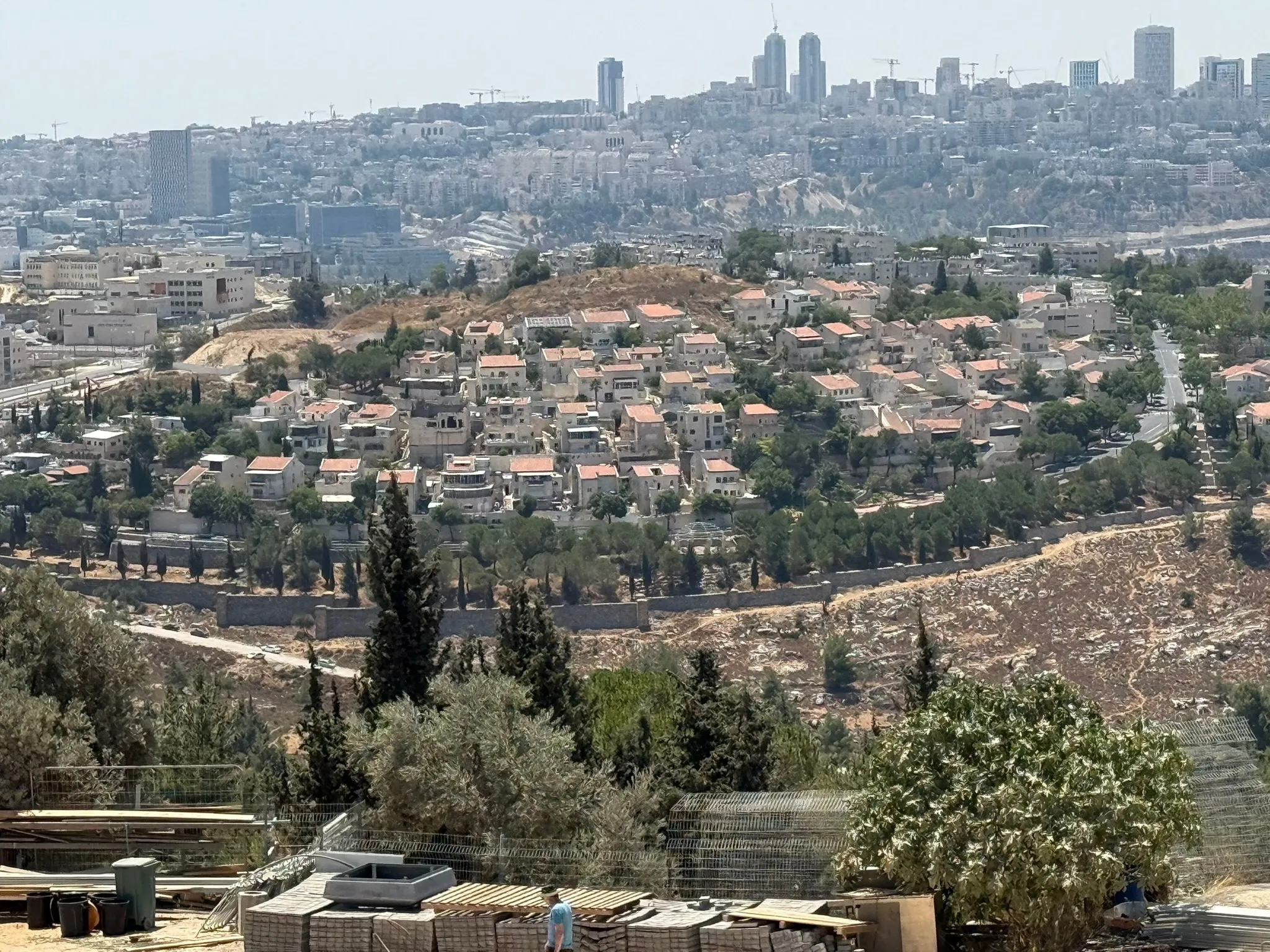 A Jerusalem cityscape with a hillside neighbourhood in the foreground